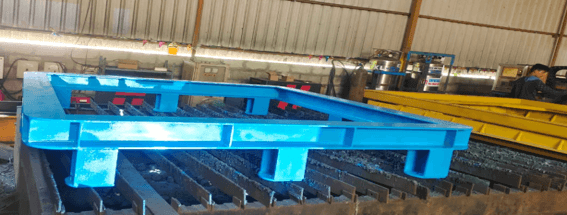 Heavy fabricated steel beam structure on laser cutting bed