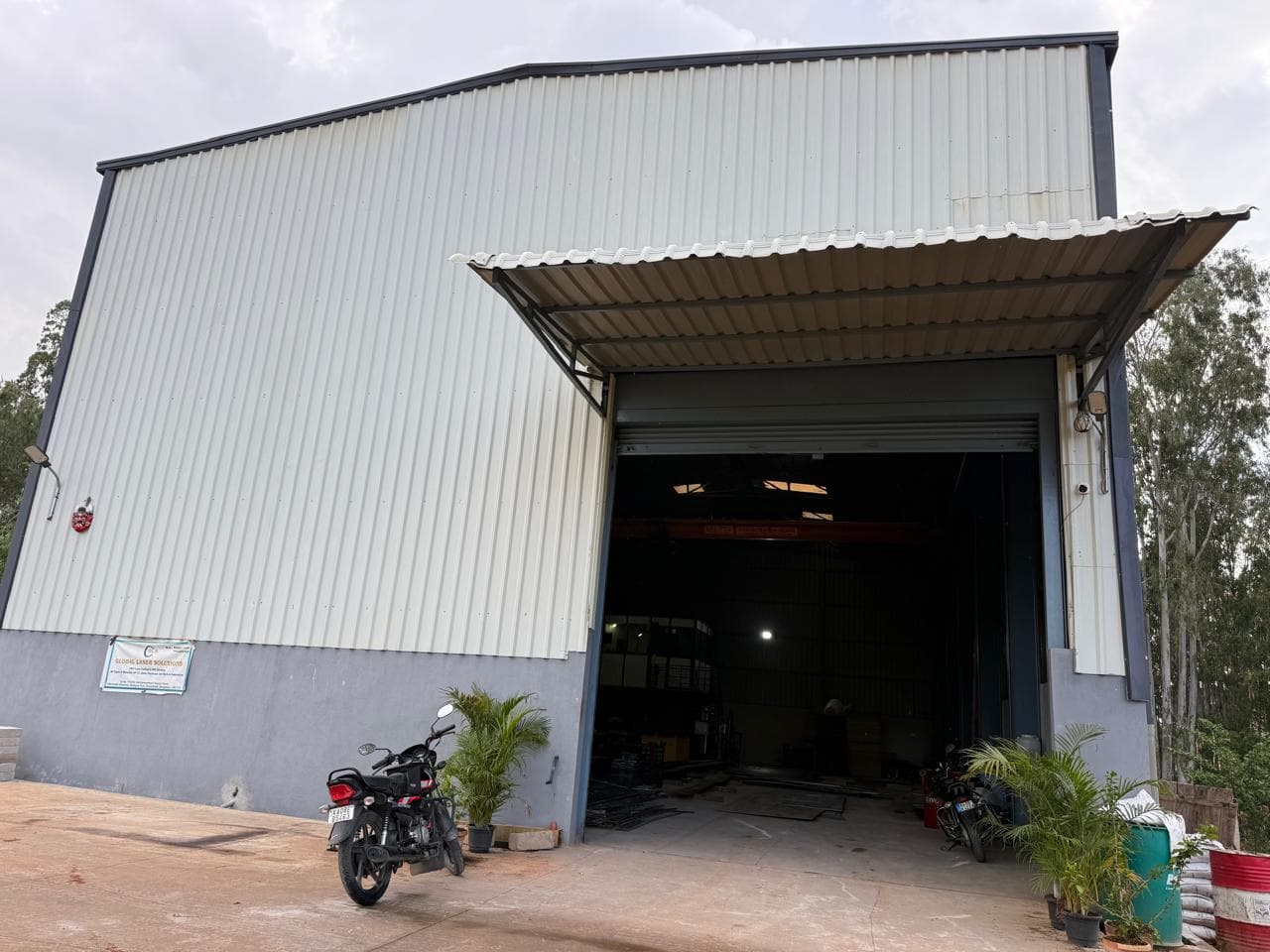 Global Laser Solutions factory building exterior with company signboard