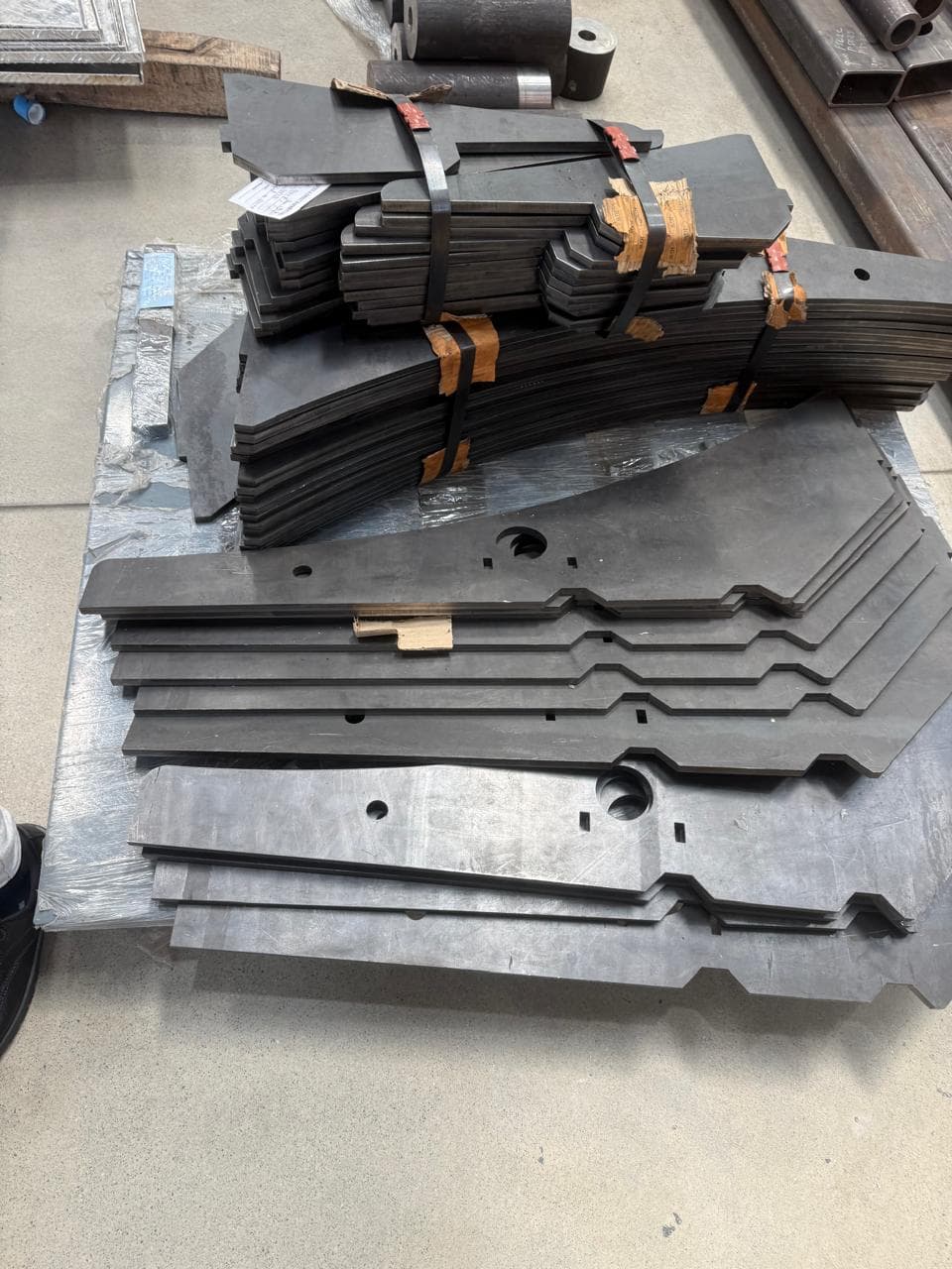 Stacked laser cut structural blade parts bundled for delivery