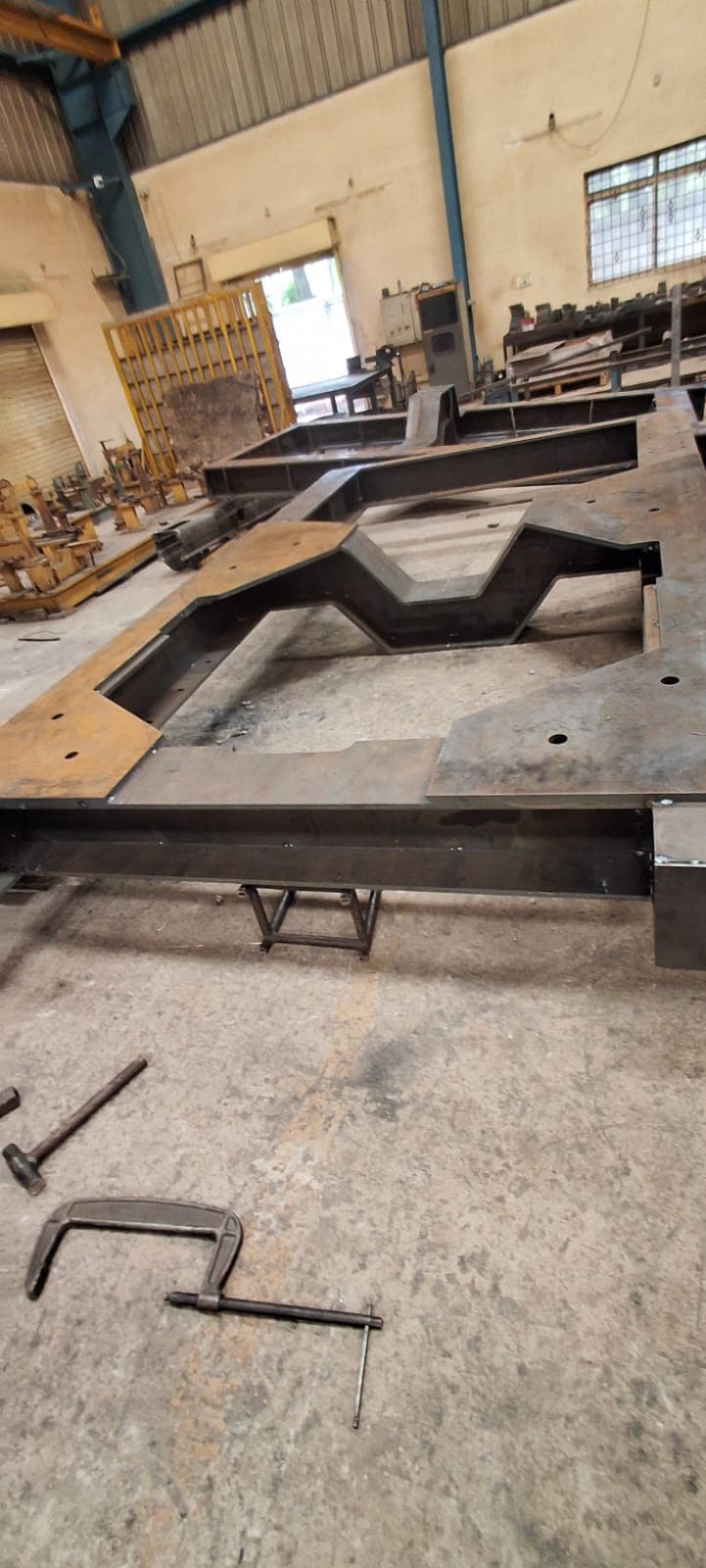 Large structural steel frame fabrication inside Global Laser Solutions workshop