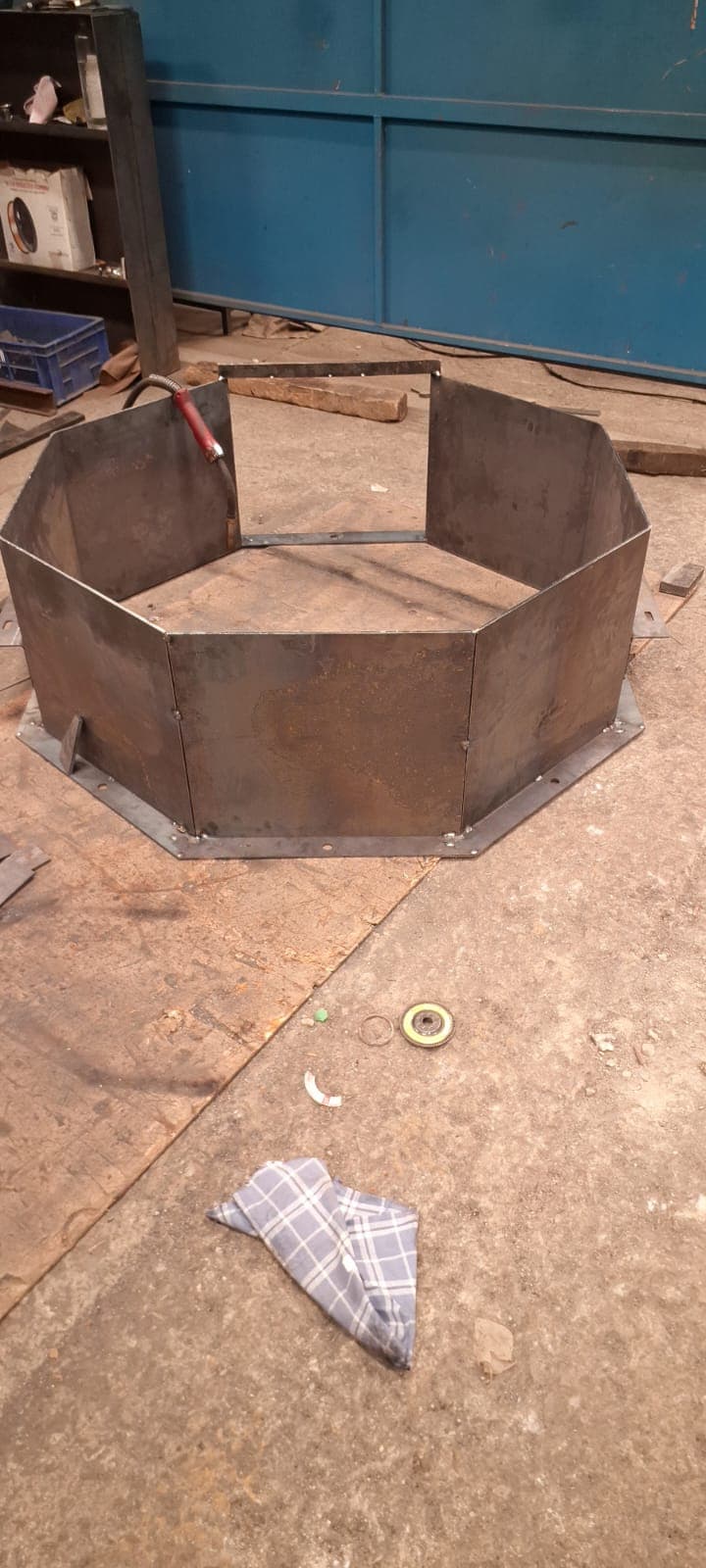 Precision laser cut octagonal ring structure assembled from steel panels